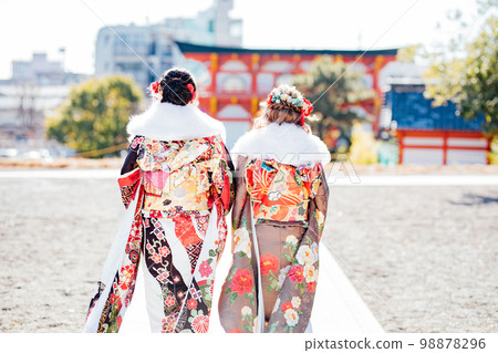 Back view of a young woman wearing a kimono Back view of a young woman wearing a kimono 98878296