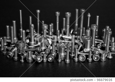 Assembly of bolts and nuts (image of machine parts) 98879016