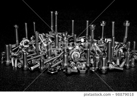 Assembly of bolts and nuts (image of machine parts) 98879018