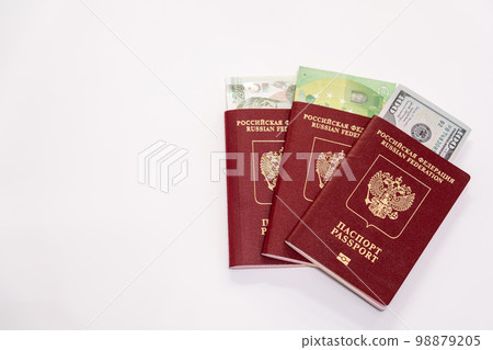 As far as passports with stacks of various world currencies nested in them and a place for an inscription As far as passports with stacks of various world currencies nested in them and a place for an inscription 98879205