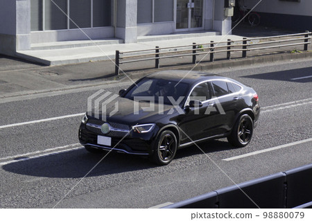 Crossover SUV utility vehicle road driving 98880079