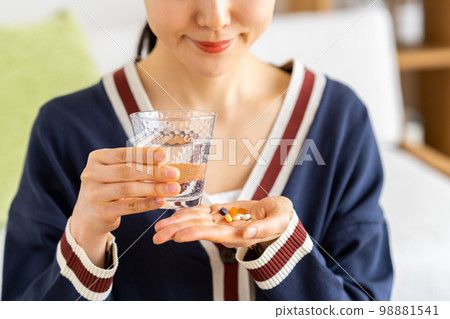 Young woman with supplements Young woman with supplements 98881541