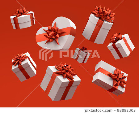 Gift boxes with ribbon and bow for Merry Christmas flying and falling on red Gift boxes with ribbon and bow for Merry Christmas flying and falling on red 98882302