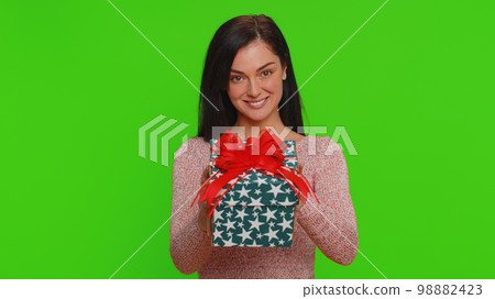 Woman presenting birthday gift box stretches out hands, offer wrapped present career celebrate bonus Woman presenting birthday gift box stretches out hands, offer wrapped present career celebrate bonus 98882423