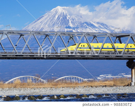 Shizuoka Prefecture Doctor Yellow and Mt. Fuji across the Fuji River January 98883072