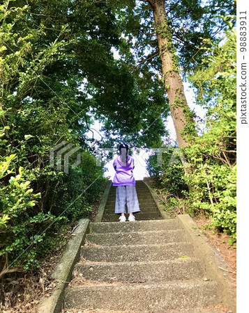 girl climbing stone stairs girl climbing stone stairs 98883911