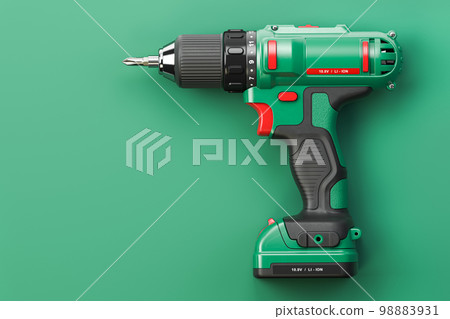 Green electric screwdriver drill on green background with space for text. Green electric screwdriver drill on green background with space for text. 98883931