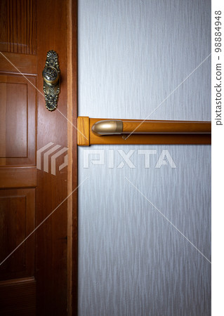 Corridor in an old house with handrails installed due to aging residents 98884948
