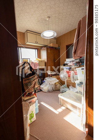 Storage room (closet) in an old house with lots of things 98885175