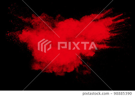 Red powder explosion cloud on black background. Freeze motion of red color dust particle splashing. Red powder explosion cloud on black background. Freeze motion of red color dust particle splashing. 98885390