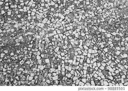 Black and white photo. Texture of paving slabs. The background of the stone. Black and white photo. Texture of paving slabs. The background of the stone. 98885501
