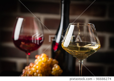 White wine in a glass White wine in a glass 98886274
