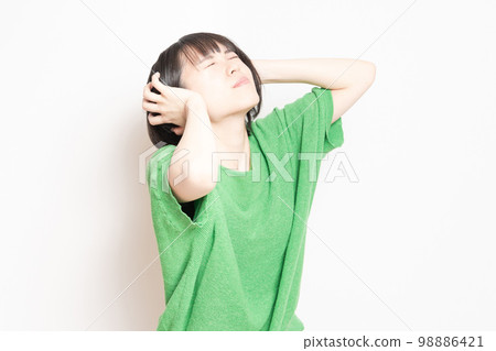 Young woman troubled by noise 98886421