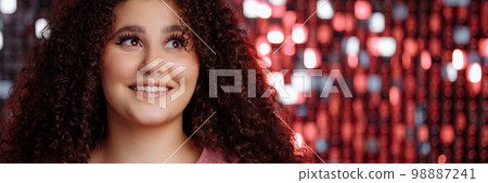 Banner girl with a curly hairstyle 98887241