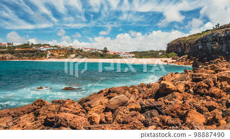 Beautiful sandy beach on summer sunny day with azure water. Aerial view Beautiful sandy beach on summer sunny day with azure water. Aerial view 98887490