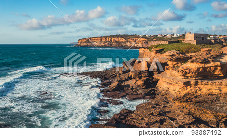Beautiful coastline seascape in Europe.  Beautiful rocky seascape with rolling waves to the shore. Aerial view 98887492
