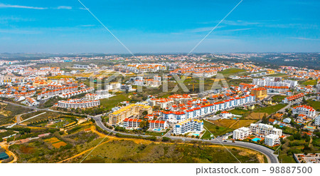 Aerial view - Beautiful European touristic town Ericeira,  Portugal. Top view of tourist region of Portugal. Beautiful cityscape with skyline. 98887500