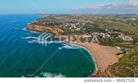 Beautiful coastline seascape in Europe. Beautiful rocky seascape with rolling waves to the shore. Aerial view Beautiful coastline seascape in Europe. Beautiful rocky seascape with rolling waves to the shore. Aerial view 98887520