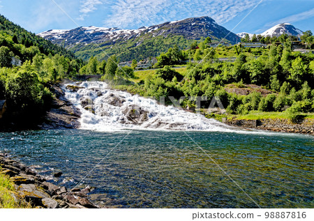 Landscape with Hellesyltfossen waterfall - Geiranger, Norway 98887816