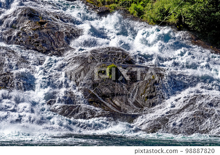 Landscape with Hellesyltfossen waterfall - Geiranger, Norway 98887820