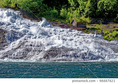 Landscape with Hellesyltfossen waterfall - Geiranger, Norway 98887821