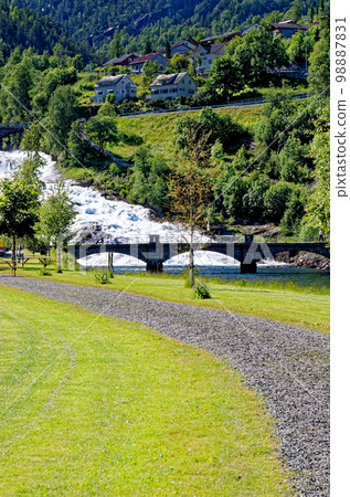 Landscape with Hellesyltfossen waterfall - Geiranger, Norway Landscape with Hellesyltfossen waterfall - Geiranger, Norway 98887831