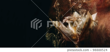 Flower paint. Abstract background. Floral art. Bronze brown color water ink splash on white lilly petals on dark black grunge copy space. 98888524
