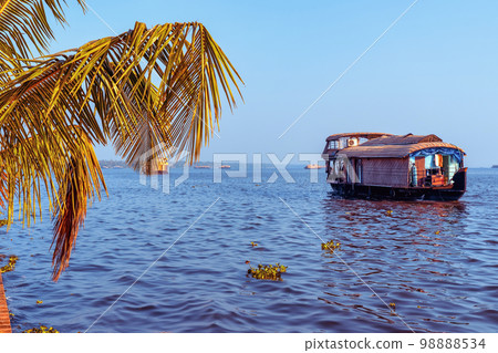 Beautiful landscape with a house boating in marine drive, Kochi, India. Travel and tourism Kerala - houseboat on Alleppey backwaters in India. Kerala houseboat image Beautiful landscape with a house boating in marine drive, Kochi, India. Travel and tourism Kerala - houseboat on Alleppey backwaters in India. Kerala houseboat image 98888534