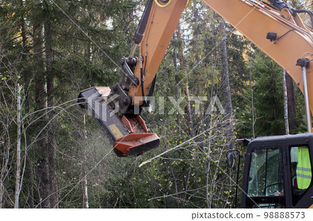 Attached to excavator forestry mulcher for clearing trees and brush along roadsides. Attached to excavator forestry mulcher for clearing trees and brush along roadsides. 98888573