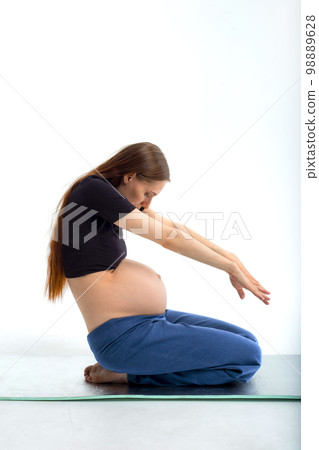 Stage of pregnancy. pregnant woman training yoga 98889628