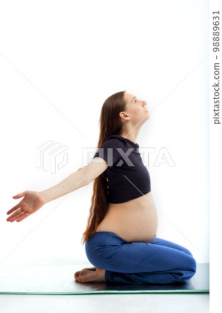 Stage of pregnancy. pregnant woman training yoga 98889631