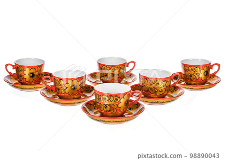 Set of tea six pairs of Old Traditional Russian folk utensils. Dishes saucer and cup with handmade painting floral ornament in style of Khokhloma isolated on white background. 98890043