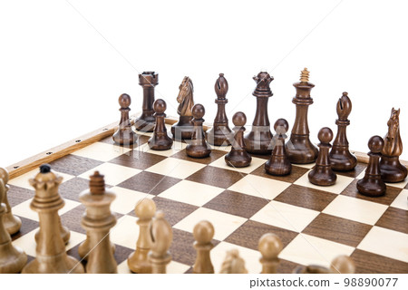 Beige Brown Wooden chess different pieces figures standing on chessboard. Close up game concept competition, Classic Gambit Tournament of confrontation. 98890077