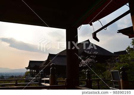Kyoto, Japan, Kiyomizudera in spring, the main hall called Kiyomizu's stage, the beautiful sunset, cherry blossoms and the townscape, the view from Okunoin 98890193
