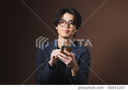 Men looking at smartphones 98891267