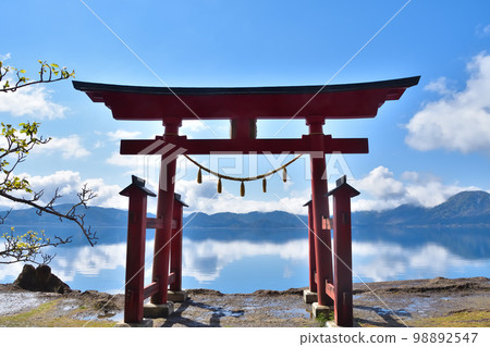 Akita Lake Tazawa in the blue sky and the torii of Gozanoishi Shrine Akita Lake Tazawa in the blue sky and the torii of Gozanoishi Shrine 98892547