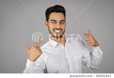 Smiling Arab Businessman Pointing Finger At Himelf And Looking At Camera 98892842