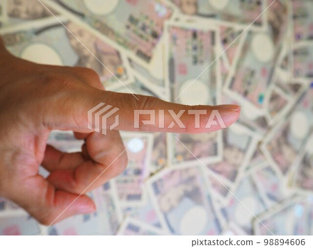 Scattered 10,000 yen bills and index finger secret sign 2 Scattered 10,000 yen bills and index finger secret sign 2 98894606