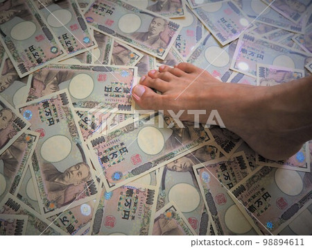 Feet stepping on scattered 10,000 yen bills Trampled money 1 Feet stepping on scattered 10,000 yen bills Trampled money 1 98894611