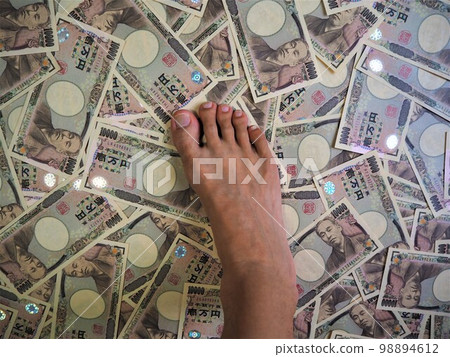 Feet stepping on scattered 10,000 yen bills Trampled money 2 Feet stepping on scattered 10,000 yen bills Trampled money 2 98894612