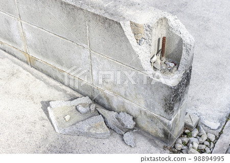 Block wall chipped by car contact 98894995