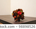 Pine cone and apple ornament 98898526
