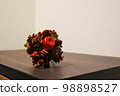 Pine cone and apple ornament 98898527
