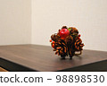 Pine cone and apple ornament 98898530