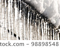 Icicles growing from the roof 98898548