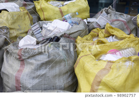 Bags of plastic garbage at a separate collection point Bags of plastic garbage at a separate collection point 98902757