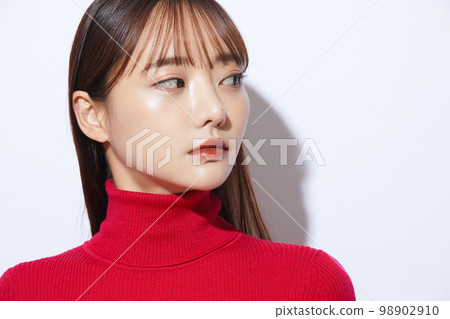 Beauty portrait of young woman in red knit 98902910