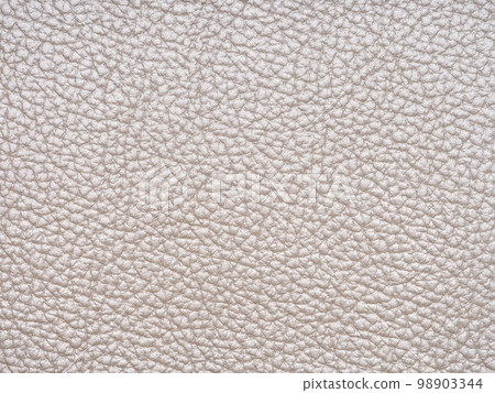 Beige leather texture sample. Genuine leather material closeup in light, soft tone. Background with copy space, top view. Backdrop blank skin effect for design, upholstered furniture, quality clothes. Beige leather texture sample. Genuine leather material closeup in light, soft tone. Background with copy space, top view. Backdrop blank skin effect for design, upholstered furniture, quality clothes. 98903344