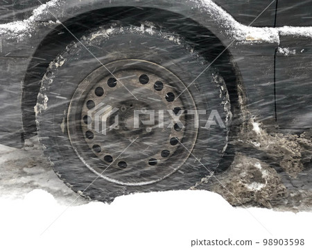 winter road, car wheel in a snowdrift 98903598