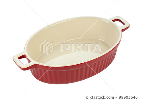 Red ceramic baking dish on a white background. Empty oval baking dish for gratin. Red ceramic baking dish on a white background. Empty oval baking dish for gratin. 98903646